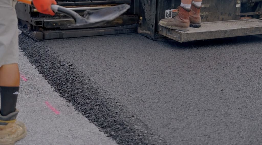 commercial paving experts doing quality paving on large roller machines around Gainesville Prince William County virginia