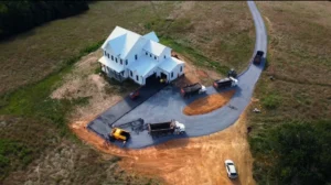 Best asphalt paving company in Prince William County, VA working with its machinery & team on a large driveway paving project